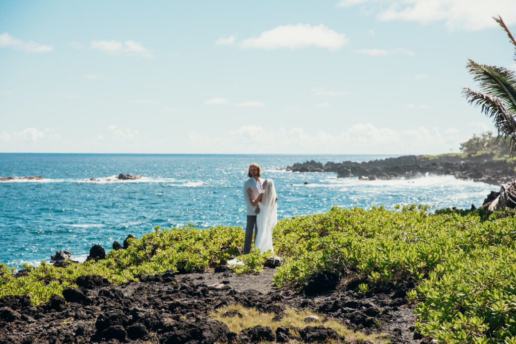 Maui Elopement Photographer captures bride and groom dancing together after intimate Hawaii beach wedding