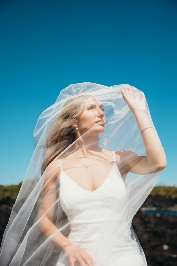 Maui Elopement Photographer captures bride wearing veil over face