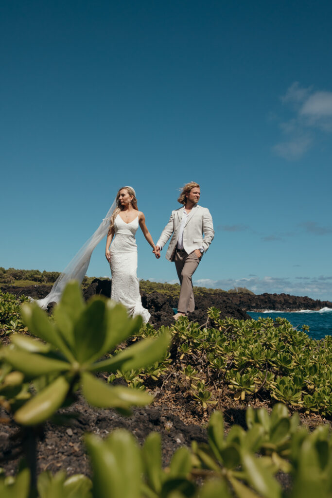 Maui Elopement Photographer captures bride and groom holding hands