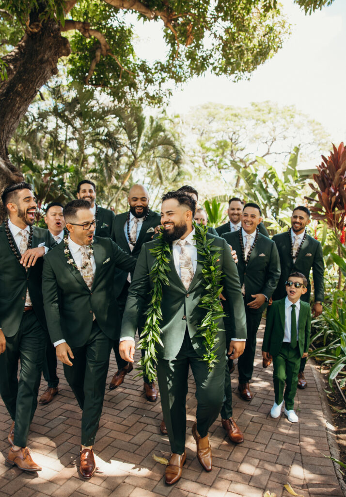 Maui Elopement Photographer captures groom walking with groomsmen