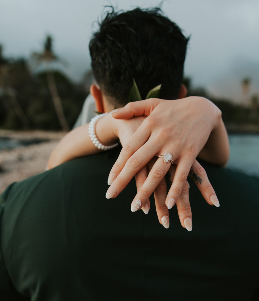 Maui Elopement Photographer captures bride's hands wrapped around groom's neck