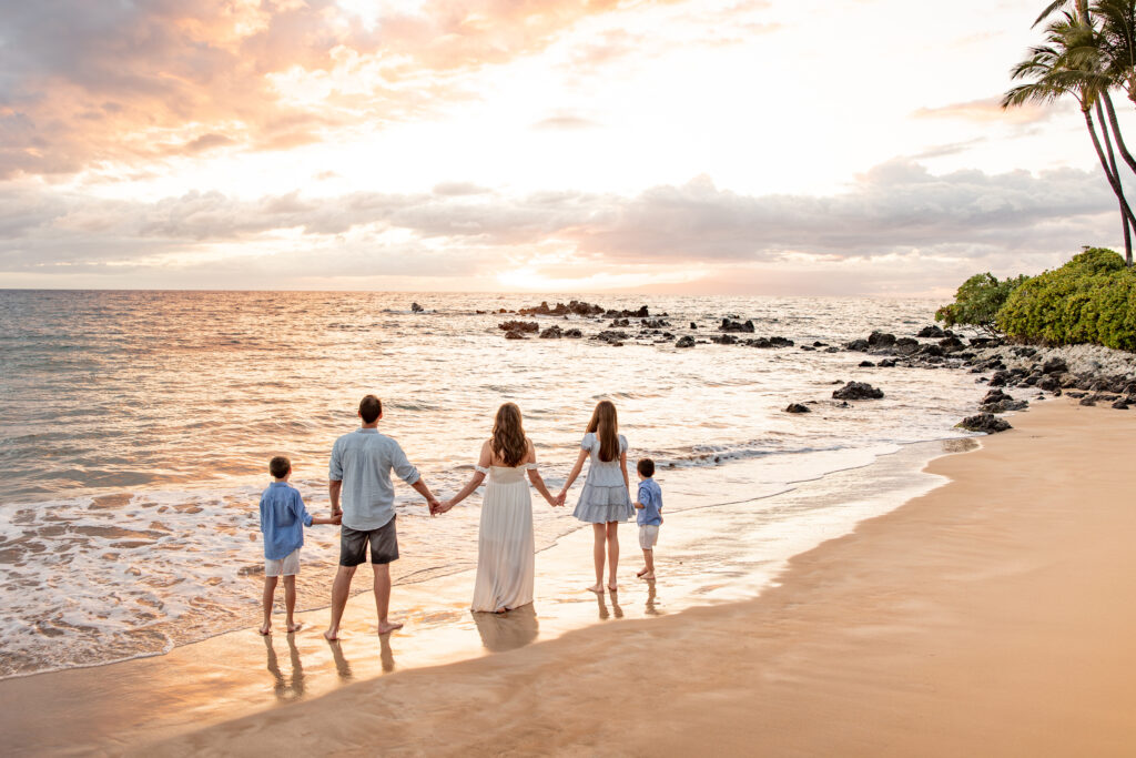 Maui Family Photographer captures family walking on beach holding hands