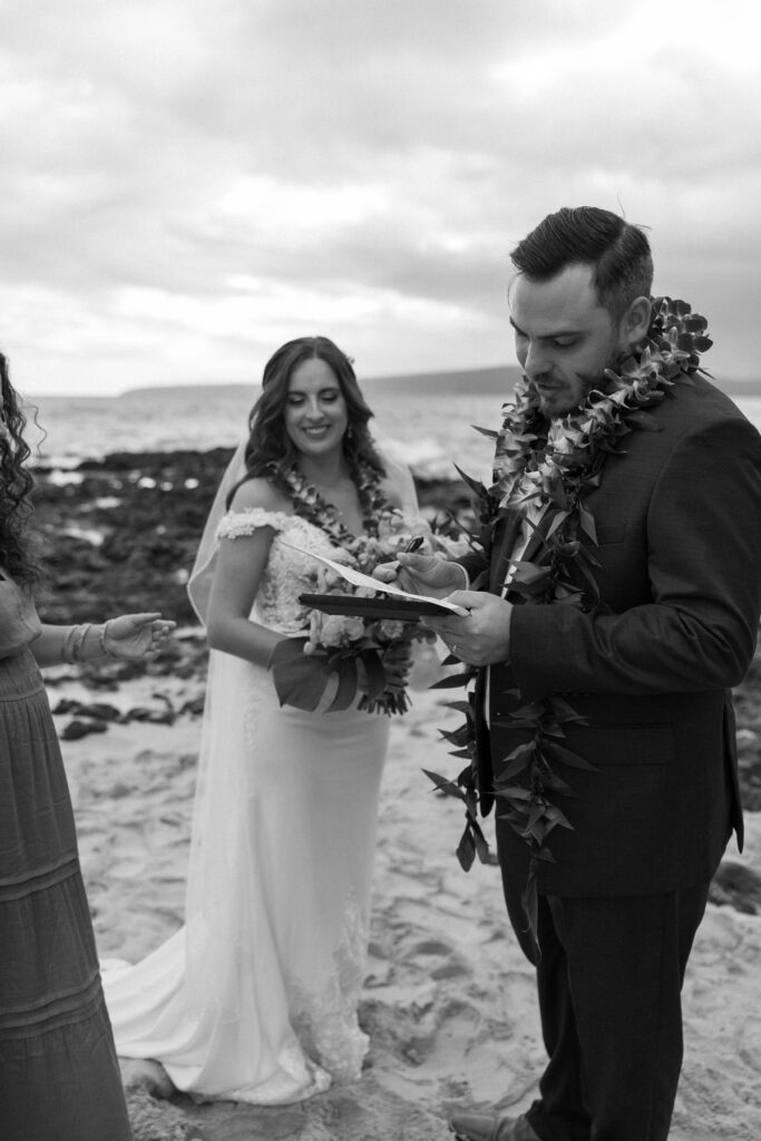 Maui Elopement Photographer captures groom signing marriage license after eloping in Hawaii