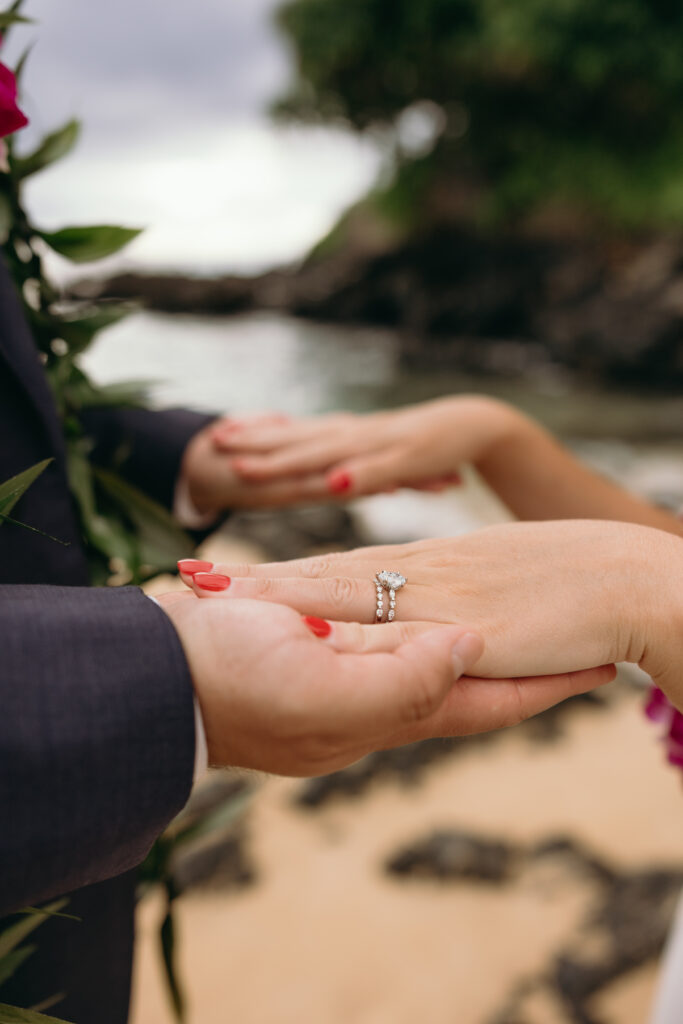 Maui Elopement Photographer captures bride and groom holding hands after ceremony