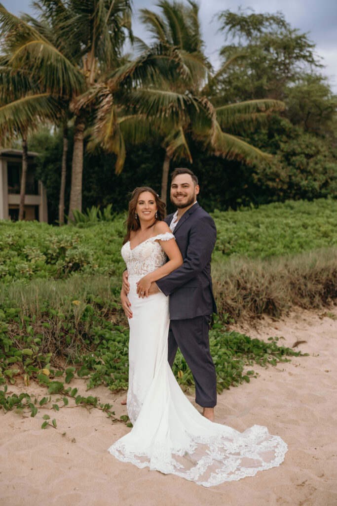 Maui Elopement Photographer captures groom holding bride's waist