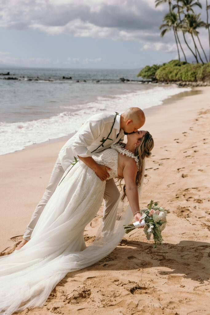 Maui Elopement Photographer captures bride groom dip kiss on the beach