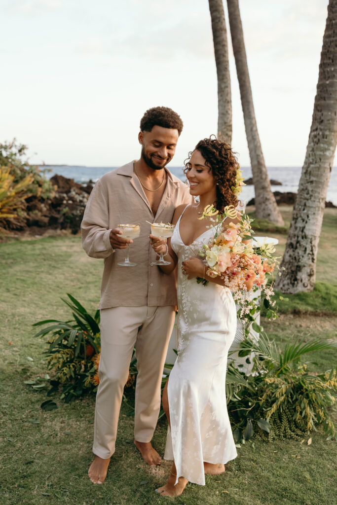 Maui Elopement Photographer captures bride and groom toasting after being married 