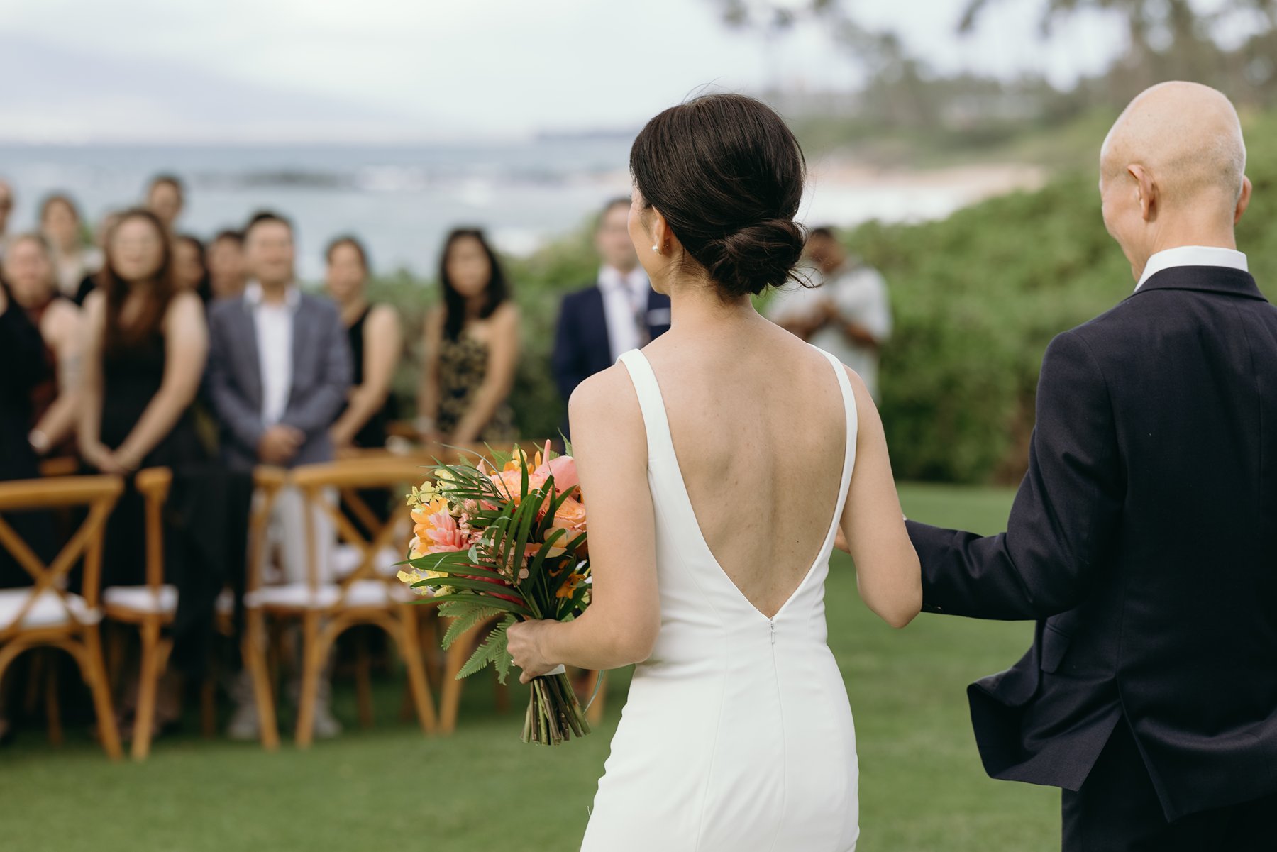 Emotional moment as groom hugs children during ceremony at resort wedding venue